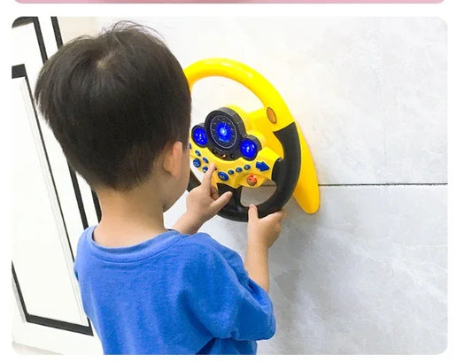 Child playing with yellow toy steering wheel wall-mounted on white tile