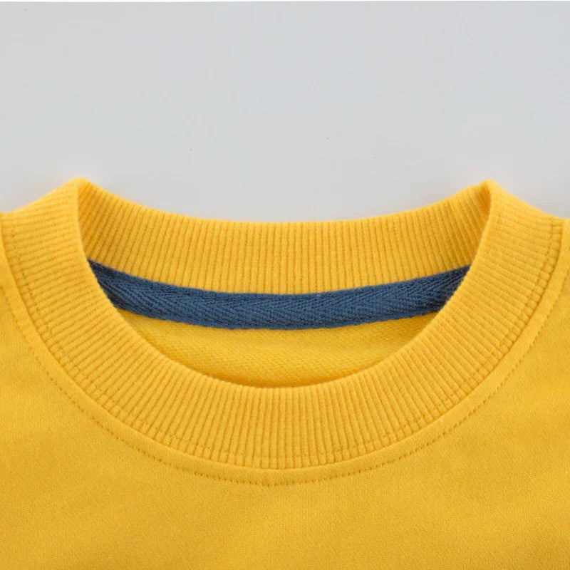 Close-up of yellow crew neck sweatshirt with ribbed collar and blue inner lining