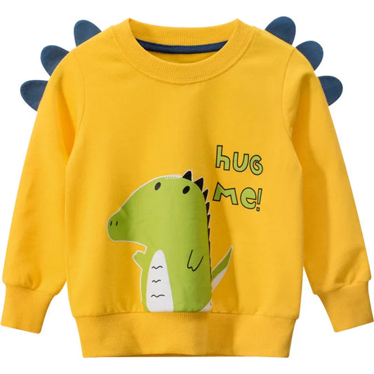 Yellow kids sweatshirt with green dinosaur print, 3D spikes, and 'Hug Me!' text