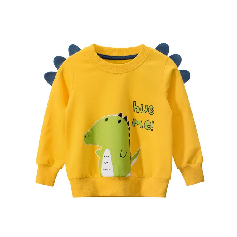 Yellow kids sweatshirt with green dinosaur print, blue spikes, and 'Hug Me!' text