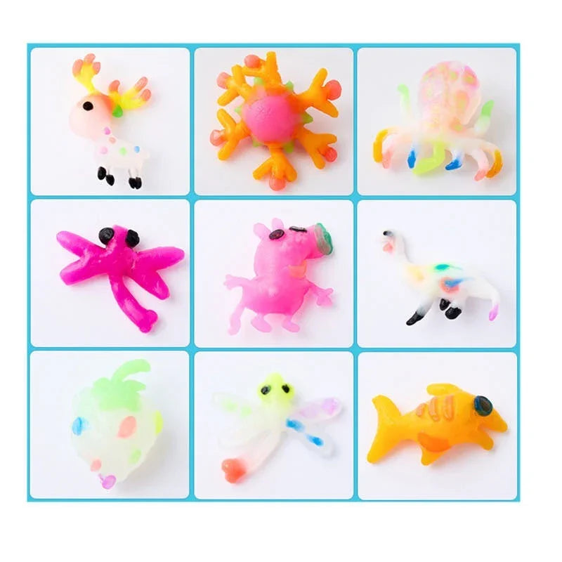 Set of nine colorful animal-shaped squishy toys on a white background with blue grid lines.